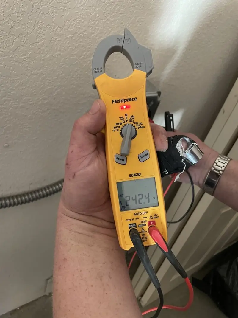 Voltage testing with clamp meter during Whole House Surge Protector in Front Royal
